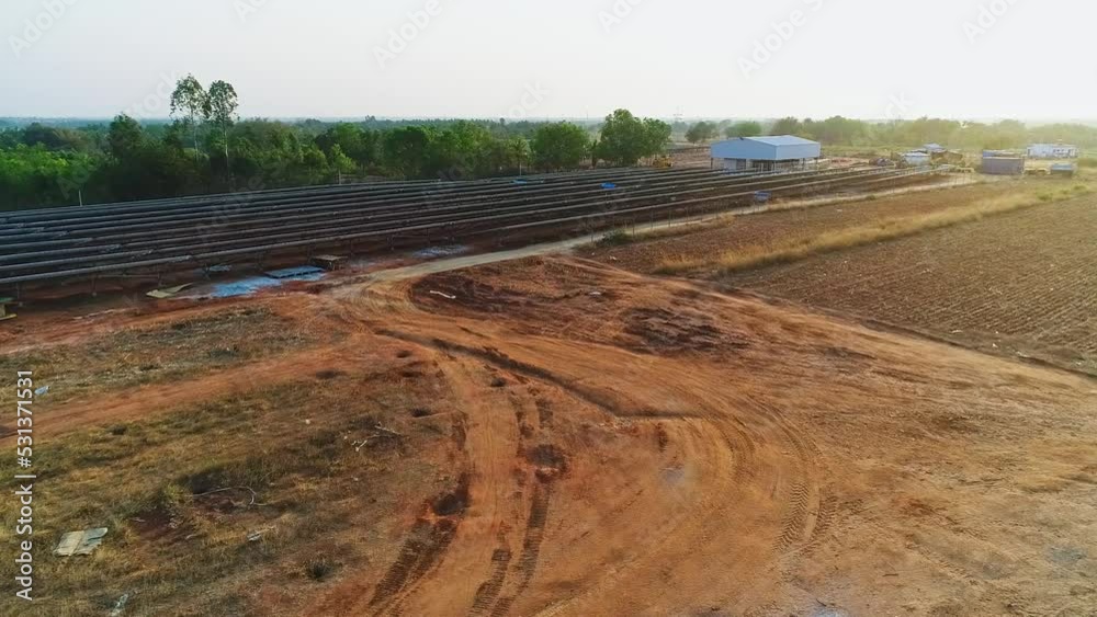 An aerial top view of solar panels installed in an agricultural land An aerial top view of solar panels installed in an agricultural land