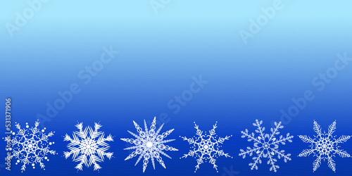 Christmas blue background with white snowflakes and space for text. Seamless border.