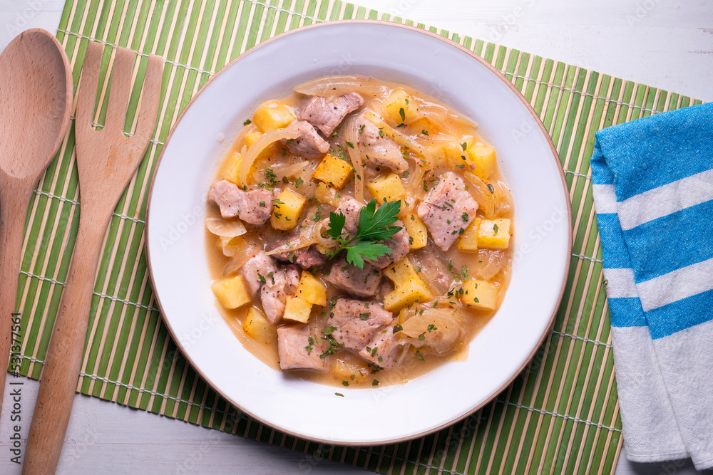 Pork stew with potatoes. Traditional tapas recipe from the north of Spain. Pork stew with potatoes. Traditional tapas recipe from the north of Spain.