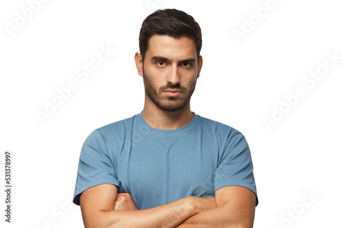 Obraz na płótnie Young man in blue t-shirts tanding with arms crossed and serious concentrated fa