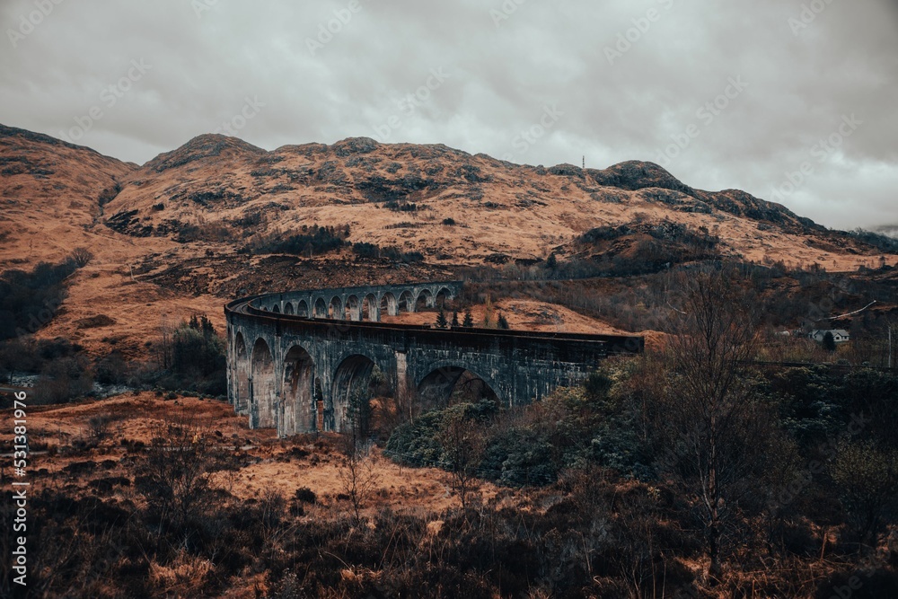 Naklejka premium High angle shot of famous Glenfinnan Viaduct bridge from Harry Potter during fall, scottland