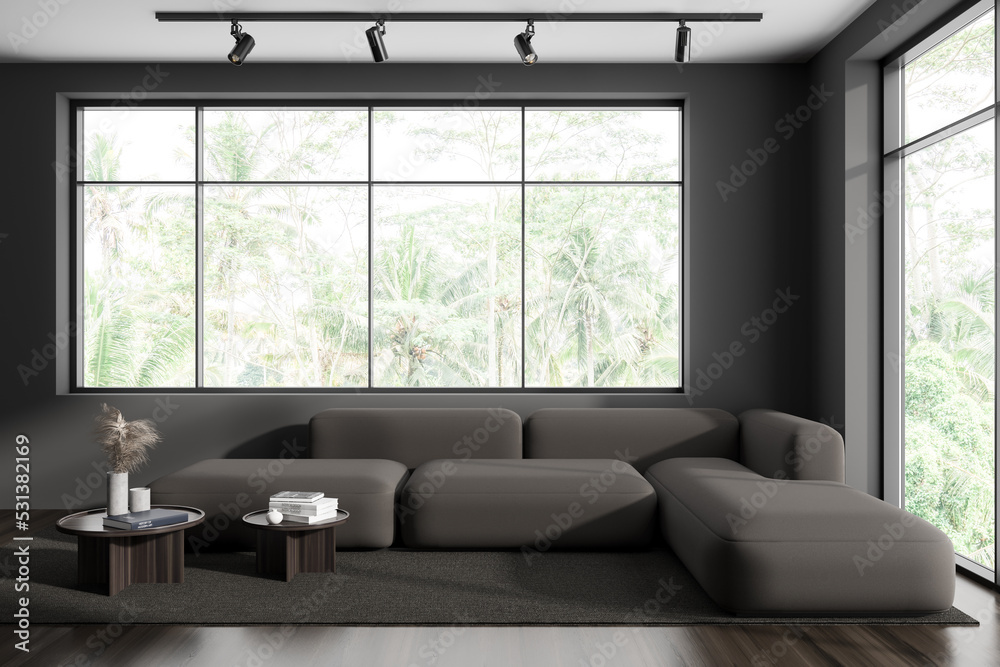 Grey chill room interior with couch and coffee table, panoramic window