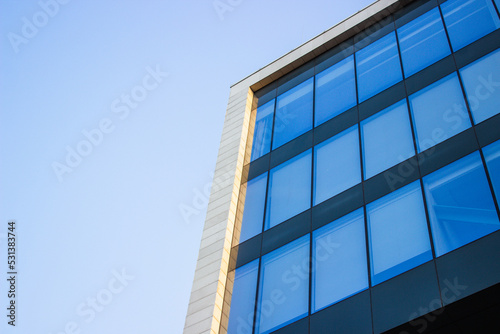 glass building against the blue sky
