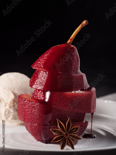 Composition with sweet poached pears and ice cream on light background dark photo