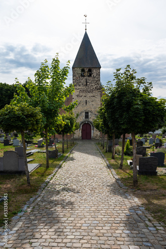 Tela Oud-Heverlee, Flemish Brabant, Belgium -  Cobble stone lane and tower of the cha