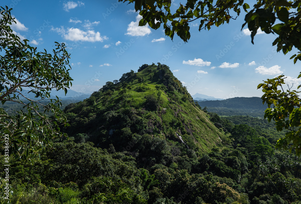 View of the green hill from the temple complex in Dambulla, Sri Lanka
