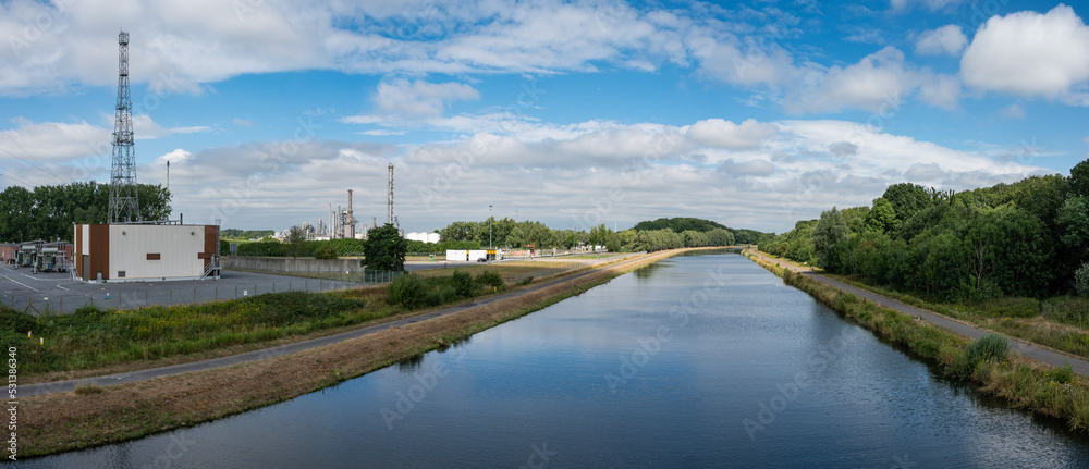 Seneffe, Wallon Region, Belgium, Old industrial plants and chimney at the banks of the sea canal Seneffe, Wallon Region, Belgium, Old industrial plants and chimney at the banks of the sea canal