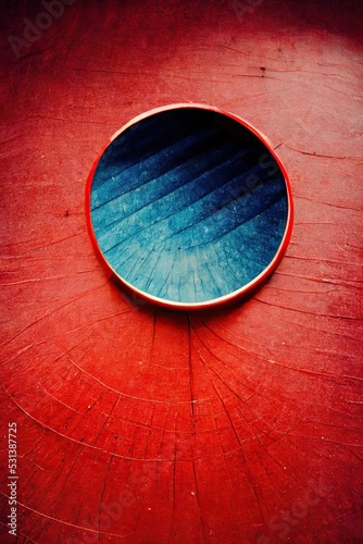 Blue and red Abstract aging enamel painted steel circle cutout metal sheets - minimalistic patterns, rough grungy industrial rust texture. Modern digital art background, highly detailed. photo