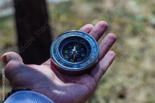 navigational compass on a man's hand