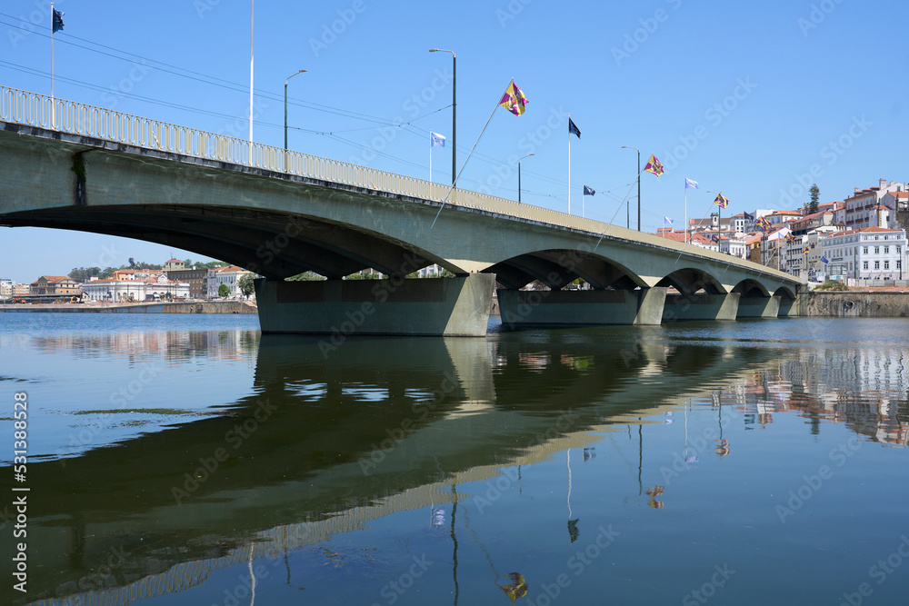 View to Santa Clara bridge at Mondego river in Coimbra city, Portugal