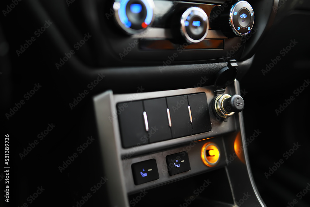 The process of choosing climate control in the car. Various controls in auto switches. Modern car interior The process of choosing climate control in the car. Various controls in auto switches. Modern car interior