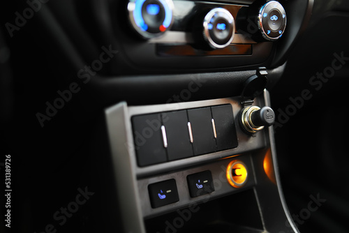 The process of choosing climate control in the car. Various controls in auto switches. Modern car interior