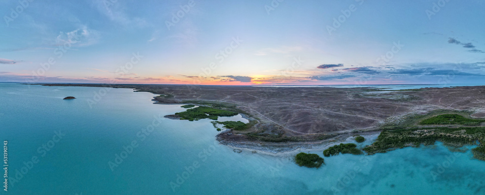 Evening on the lake. Sunset on the lake view from the quadcopter. Aerial photography on the lake