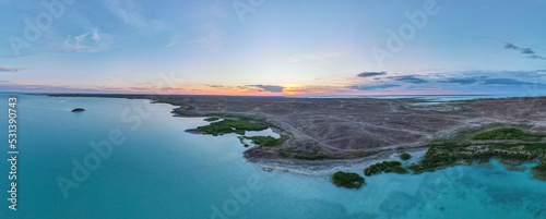 Evening on the lake. Sunset on the lake view from the quadcopter. Aerial photography on the lake