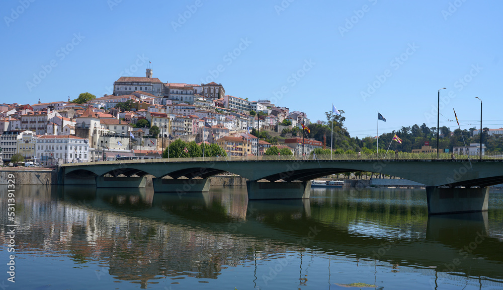 Panorama of Santa Clara bridge over Mondego river in Coimbra, Portugal