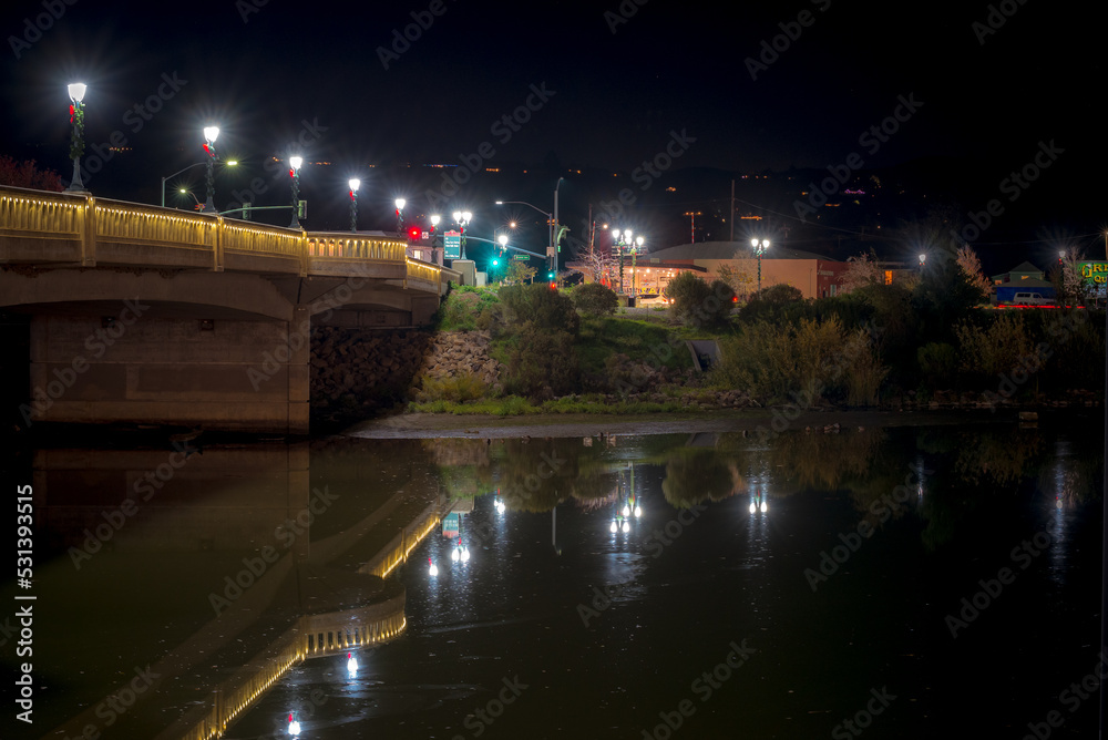 Reflections in river water in downtown napa valley