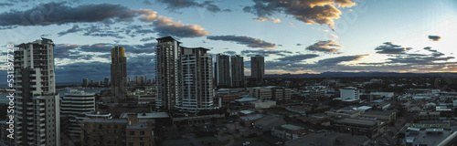 Panoramic skyline and modern buildings. Asphalt road and cityscape at sunrise © Moon Story