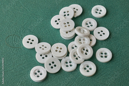 white plastic buttons for sewing