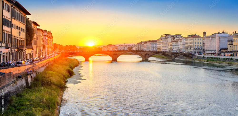 Panoramic view of the sunset on the bridges of Florence, Italy. Architecture and landmark of Florence.
