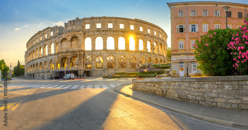 Panorama medieval Ancient Roman Amphitheater in Pula at dawn, Croatia. Architecture and landmark of Croatia. Travel concept background.