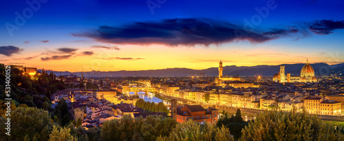 Magnificent evening panorama overlooking the river Arno, with Ponte Vecchio, Palazzo Vecchio and Cathedral of Santa Maria del Fiore during sunset, Florence, Italy