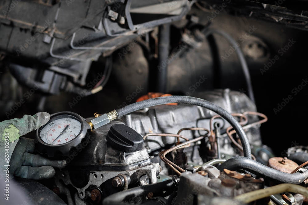 measurement of compression pressure in the cylinders of a car engine.