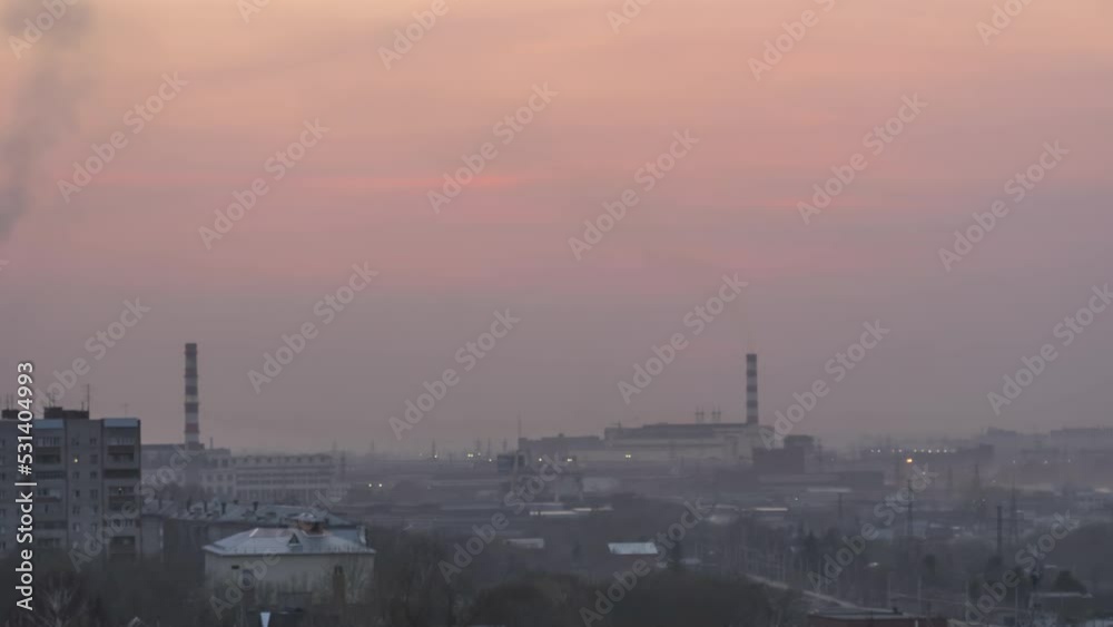 Red Sunset over the city, timelapse. Smog from smoke or fog in the evening industrial city. City evening landscape Red Sunset over the city, timelapse. Smog from smoke or fog in the evening industrial city. City evening landscape