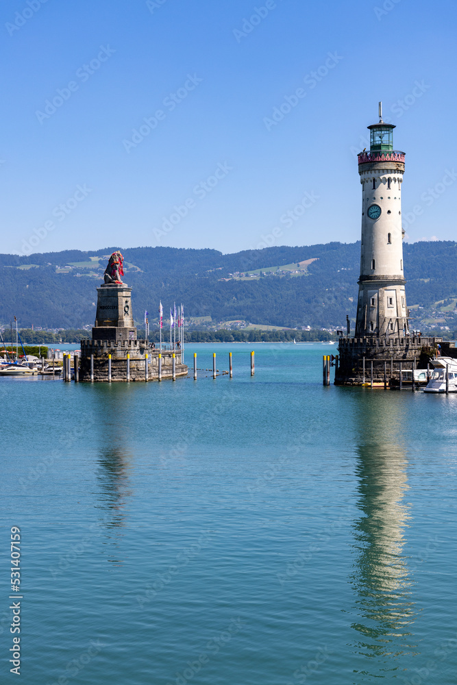 Lighthouse and the Bavarian Lion at the entrance of the marina in the city of Lindau, Bodensee, Germany