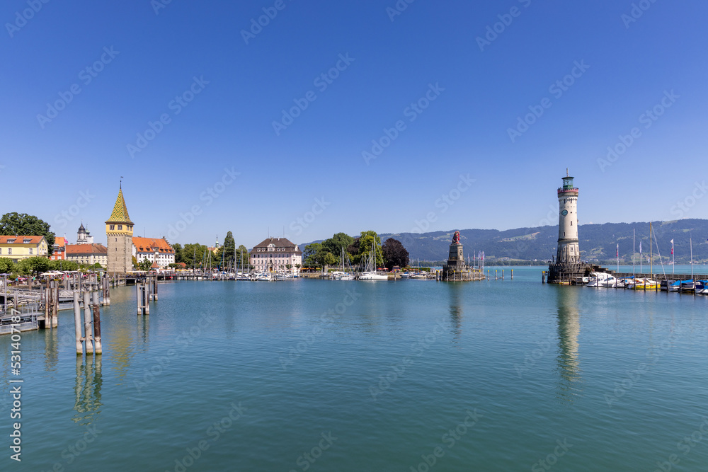 Obraz premium Marina of Lindau, Bodensee, Germany, with the lighthouse, the Bavarian Lion and the Mangturm tower in the background
