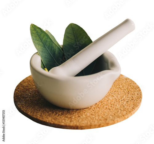 Small porcelain mortar with herbs, isolated. photo