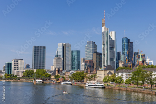 Frankfurt skyline and Eiserner steg bridge bridge at daytime with the Main river in the foreground  taken from the Alte Br  cke bridge