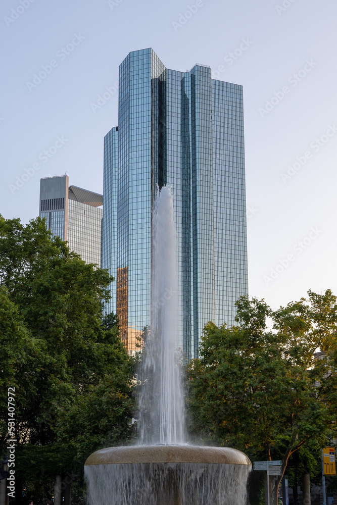 The Lucae Brunnen fountain in Frankfurt, Germany, with the twin towers in the background