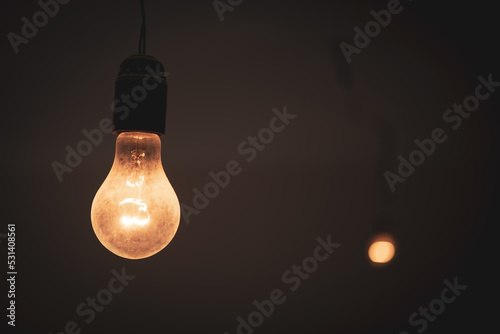 Fotobehang old light bulb sticking out of the ceiling