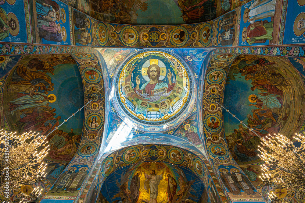St. Petersburg, Russia - June 26, 2022: Painting on the ceiling of the famous Church of the Savior on Spilled Blood. Fresco icon portrait of St. Jesus from inside the dome of the temple