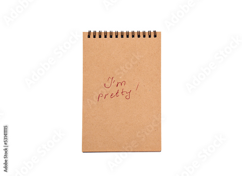 Positive statements. A phrase on a note sheet on a white background. Motivational concept with handwritten text. Craft notebook. phrase I'm pretty  © Diana