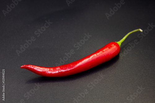 Red hot natural chili pepper. Fresh organic chili pepper on black