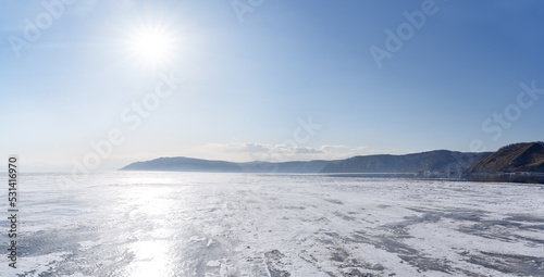 Winter landscape with mountains and Lake Baikal in Siberia on sunny day. Natural background. © LanaUst