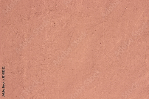 Light pink terracotta plaster rough wall texture background	 photo