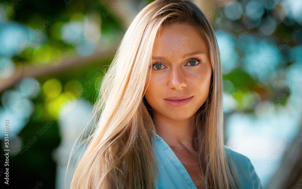 fashion portrait of beautiful young blonde girl standing in palms and watching with her perfect eyes on Bali fashion portrait of beautiful young blonde girl standing in palms and watching with her perfect eyes on Bali
