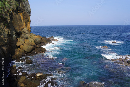 Iconic rock at the papuma beach Jember, Indonesia photo