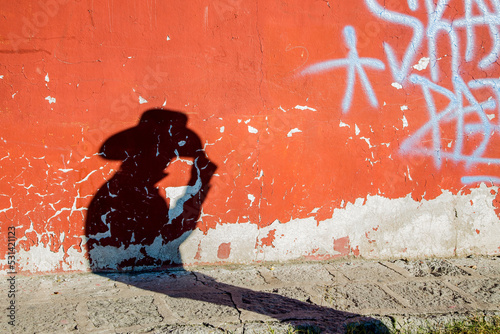 mans shadow on wall