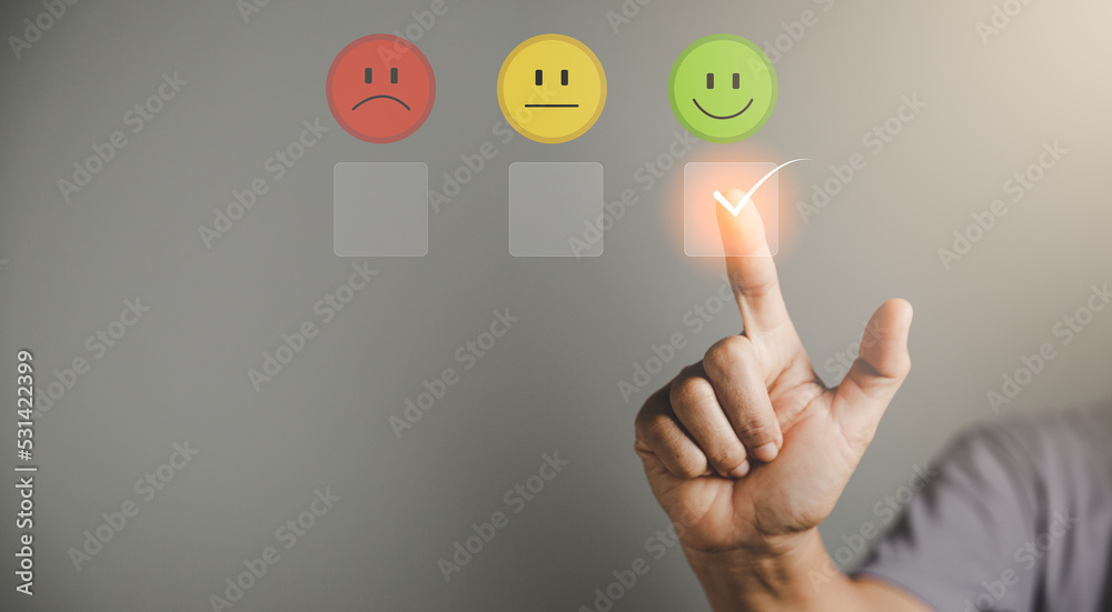 Customer service and Satisfaction concept, Business person are touching the virtual screen on happy Smiley face icon to give satisfaction in service. rating very impressed. customer service feedback. Customer service and Satisfaction concept, Business person are touching the virtual screen on happy Smiley face icon to give satisfaction in service. rating very impressed. customer service feedback.