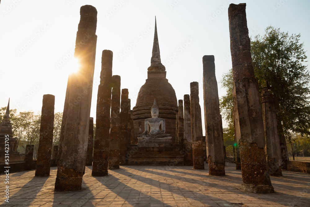 Wat sra sri buddhist temple, pagoda and colums with a Buddha statue in Sukhothai Historical Park