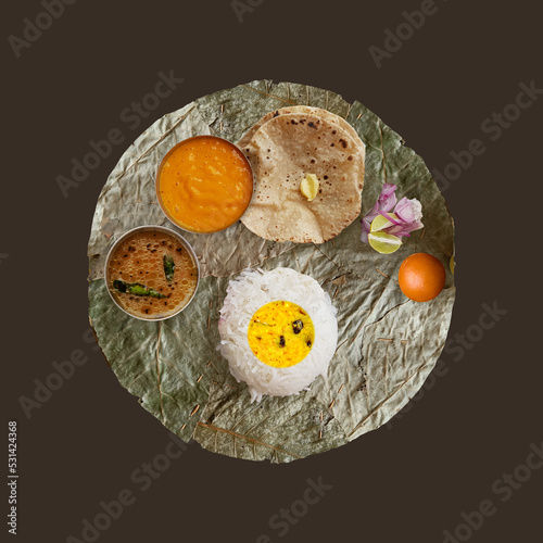 Patravali or Pattal or Vistaraku or Vistar or Khali is an Indian eating plate or trencher made with broad dried leaves. It is mainly made from sal leaves. Eco friendly dish or plate. photo