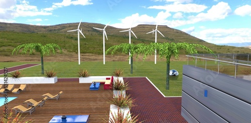 Fotografie View from the balcony of a modern country house on the adjacent territory with a recreation area and wind turbines as a source of renewable electricity