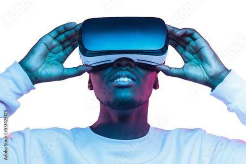 Virtual reality or metaverse concept. Close-up studio portrait of african man in VR glasses photo