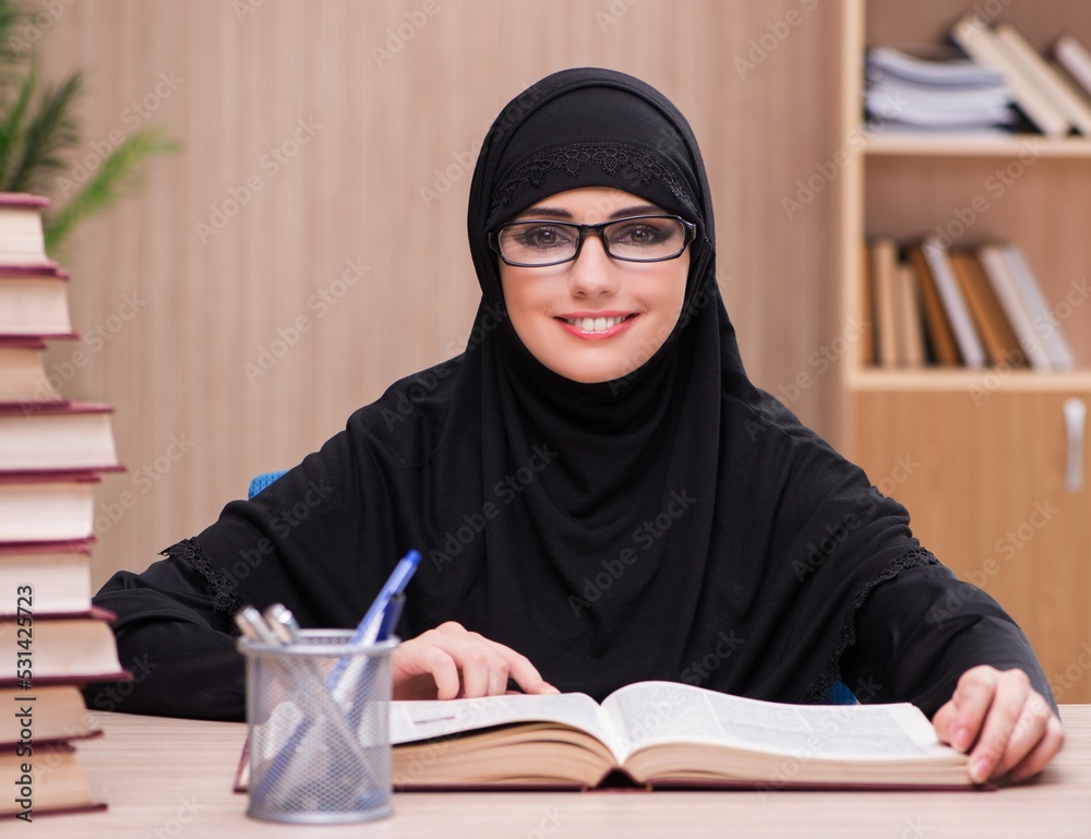 Woman muslim student preparing for exams Woman muslim student preparing for exams