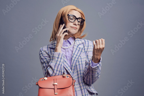 Foto Snobbish woman having a phone call