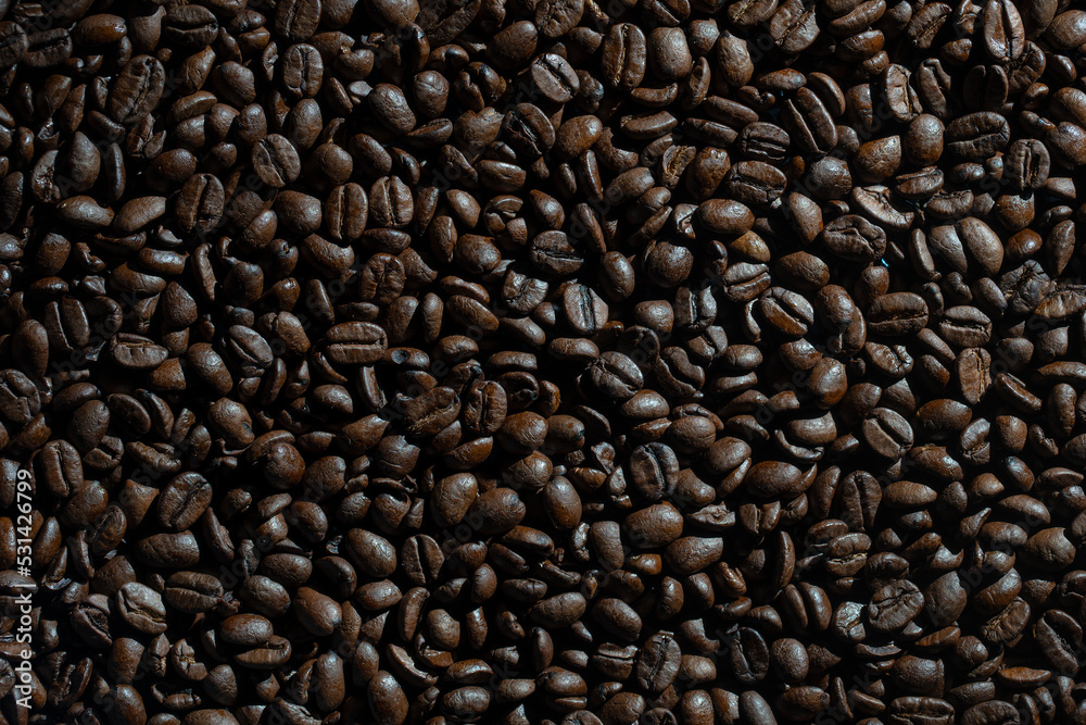 Background of fresh roasted coffee beans, close up, top view Background of fresh roasted coffee beans, close up, top view