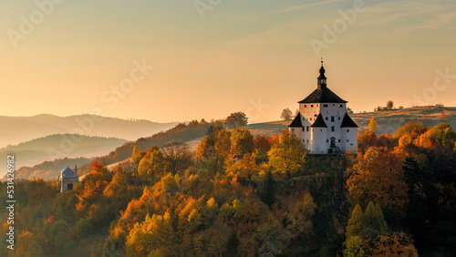 The New Castle in Banska Stiavnica at sunrise in an autumn season, Slovakia, Europe. photo